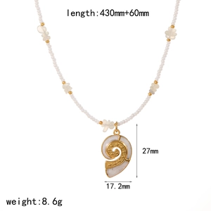 Bohemian pearl necklace with gold turtle shell pendant and shell bead details