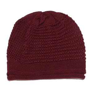 Close-up of dark red knitted beanie featuring horizontal ribbed texture and cuffed hem