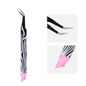 Macro detail of precision curved tweezers with zebra pattern and silicone pressing tool
