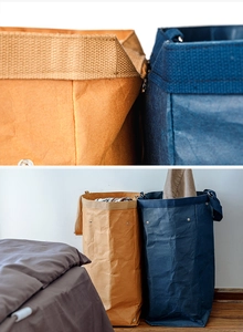 Close-up of washable kraft paper storage basket featuring rivet details and soft texture