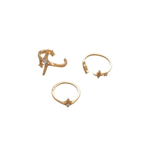 Three-piece gold ring set with starburst design and rectangular zircon accents
