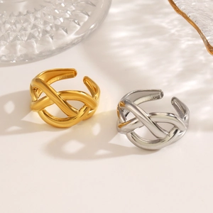 Minimalist irregular interlocking 18K gold plated open ring on a glass display stand