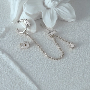 Close-up of S925 silver earring set showing opal studs and fine chain with 925 stamp