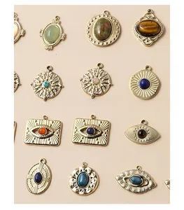 Detail of vintage bohemian lapis lazuli and turquoise pendants in gold finish