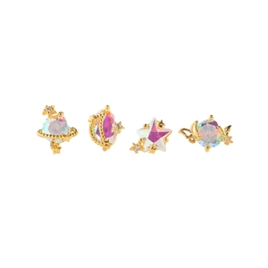 Star and moon 18K gold plated earrings set with iridescent rhinestones on white backdrop