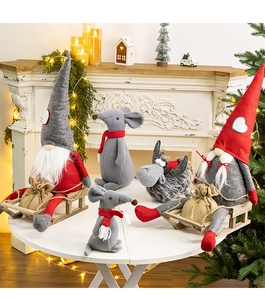 Close-up of assorted plush Christmas gnomes and animals with rustic knit textures