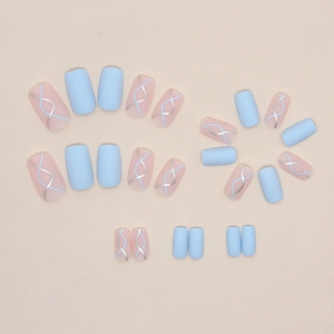 Matte sky blue and nude pink press-on nails with silver wave lines in medium-long length