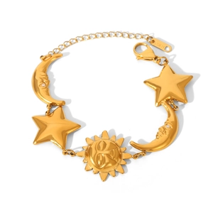 Golden stainless steel bracelet featuring sun, moon, and star charms with crystal accents