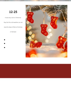 Detail of red hollowed-out sock LED string lights hanging on Christmas tree branches