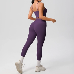 Detail of high-waisted dark purple yoga set with thin straps and supportive fit