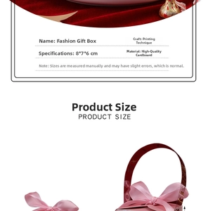 Close-up of pink gift box with silk bow featuring ink-wash design and gold stamping