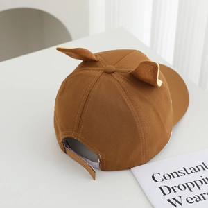 Detail of baby baseball cap featuring 3D animal ears and adjustable rear strap strap