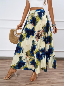 Detailed view of lightweight pleated skirt with colorful abstract oil painting print