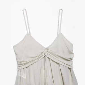 Elegant pearl white georgette lace camisole with pleated V-neck and satin texture