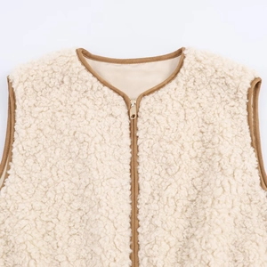 Chic beige faux shearling vest with brown trim and metal zipper closure for women