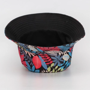 Detailed view of the colorful leaf pattern and black interior of the bucket hat.