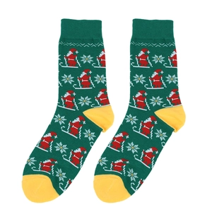 Detail of Christmas crew socks with knitted skiing Santa Claus and snowflake patterns