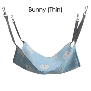 Detail of light blue cat hammock with rabbit patterns and sturdy metal hanging hooks