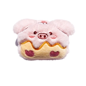 Simpatico accessorio cupcake maialino rosa in peluche con dettagli ricamati su bianco