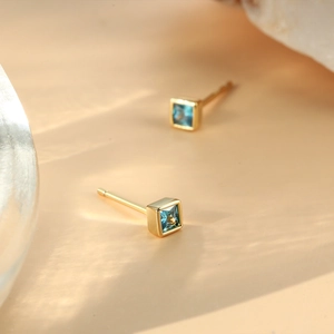 Elegant pair of square blue zircon stud earrings with premium gold-plated frames