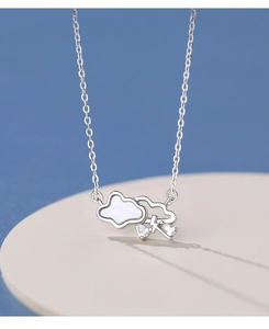 Macro shot of S999 silver cloud necklace featuring white shell inlay and lightning charms