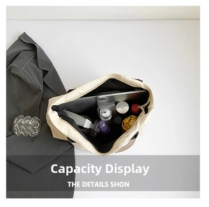 Spacious interior of beige woven tote bag holding laptop, phone, and daily essentials