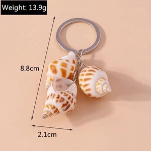 Detail view of a shell keychain showing 8.8cm length and 13.9g weight specifications