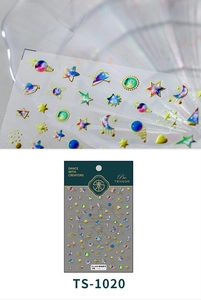 Macro detail of 3D embossed galaxy nail art stickers with gold foil star and moon patterns