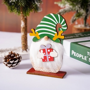 Detail of wooden Christmas gnome with white faux fur beard and red gift box ornament