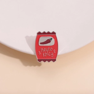 Red neuro spicy snack bag enamel brooch with chili design on minimalist display stand