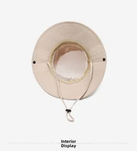 Interior view of sun hat showing breathable white mesh lining and adjustable chin strap