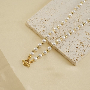 18k gold plated stainless steel necklace with white pearls and golden toggle clasp