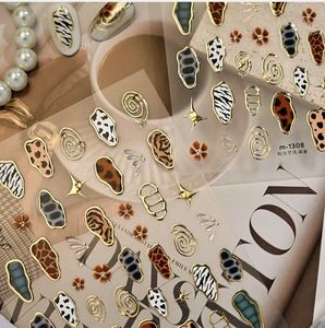 Detail of animal print nail stickers with gold metallic edges on a fashion magazine