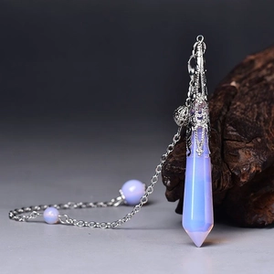 Macro detail of hexagonal opalite pillar necklace with intricate silver alloy floral cap