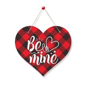 Plaid heart wood hanging sign with Be Mine lettering for Valentine's day party decor