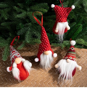 Set of 4 Christmas gnomes with knit hats and plush beards hanging on a tree