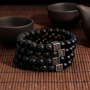 Handmade black lava stone and agate beaded bracelets with custom metal letter charms