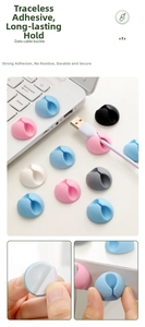 Macro detail of multi-color silicone cable clips with adhesive backing for desk management