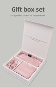 Detailed view of luxury silk gift set in pink including eye mask, scrunchie and pillowcase