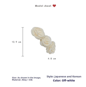 Detail showing dimensions of 10.9cm cream silk rose hair clip with an alloy base