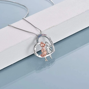 Detail of S925 silver heart necklace with sister carving and colorful zircon stones