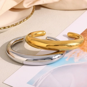 Polished gold and silver stainless steel C-shaped open bangles with thick minimalist design