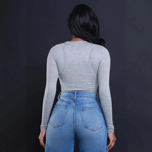 Women's ripped jeans with high waist and grey slim long sleeve ribbed knit sweater