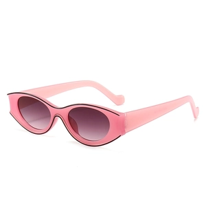 Retro pink oval sunglasses with black painted trim and stylish wavy temples