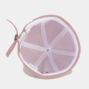 Pink cotton docker hat showing internal six-panel structure and adjustable metal buckle
