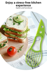 Detailed view of green 3-in-1 avocado slicer for cutting, pitting and slicing fruit