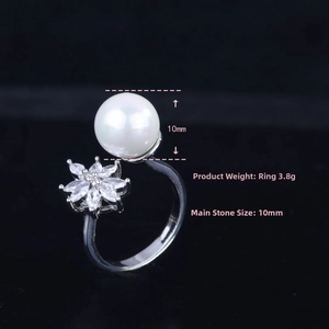 Detail of 10mm white pearl ring with zircon floral petals on silver band