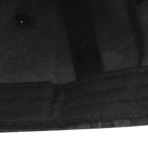 Detailed close-up of inner sweatband and stitching on washed cotton baseball cap
