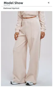 Detailed full-body view of oatmeal apricot tracksuit with classic side stripes