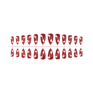 Red cat-eye press-on nails set in almond shape with white heart patterns and high gloss finish